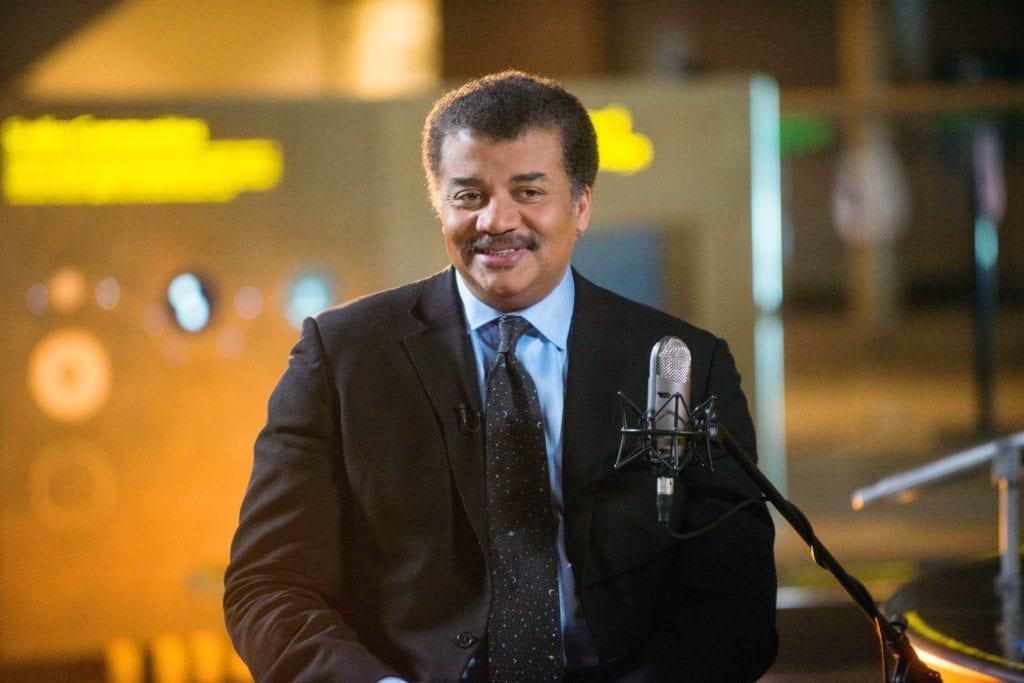 Neil deGrasse Tyson on the set of his new talk show series “StarTalk” filmed with a live studio audience in the Hayden Planetarium at the American Museum of Natural History. “Star Talk” premieres on National Geographic Channel in April. (photo credit:  National Geographic Channels/Scott Gries)